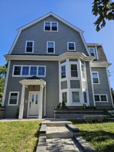 Sage green siding. Ne home construction Somerville, MA